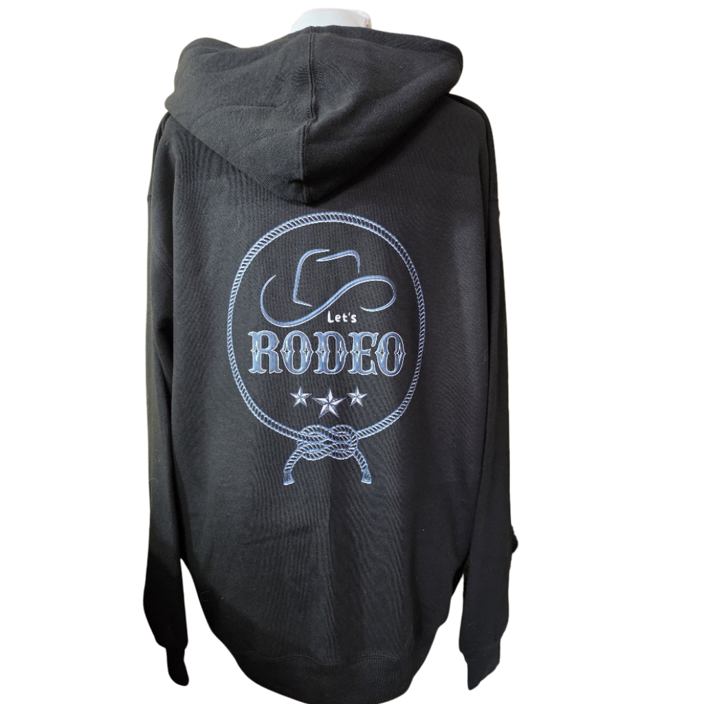 A black hooded sweatshirt shown from the back, featuring a large light blue and white 'Let's RODEO' graphic with a cowboy hat, rope border, and stars.
