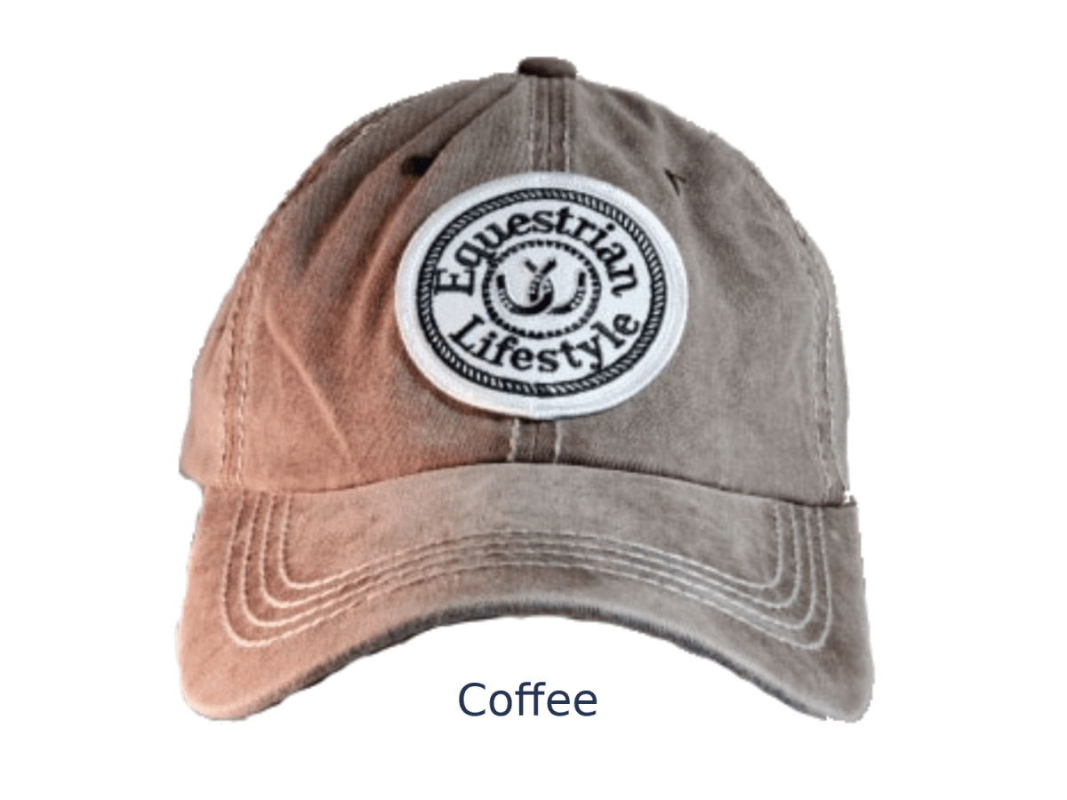 A washed baseball cap in a medium brownish-gray color, labeled 'Coffee' underneath. It features a circular embroidered patch on the front that reads 'Equestrian Lifestyle'.