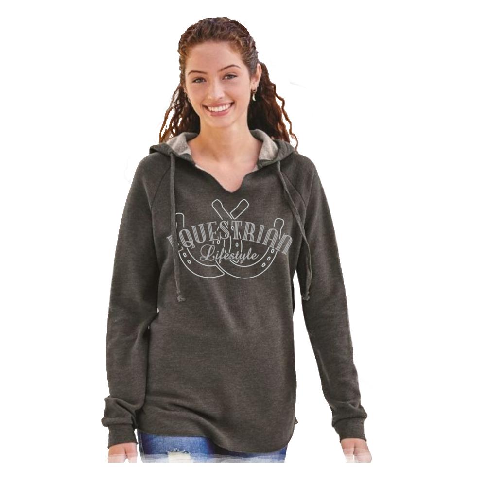 A woman modeling a dark heather gray hoodie with a white 'Equestrian Lifestyle' graphic featuring a horsehoe design on the front. The hoodie has a gray hood lining and drawstrings, and is shown against a plain white background.