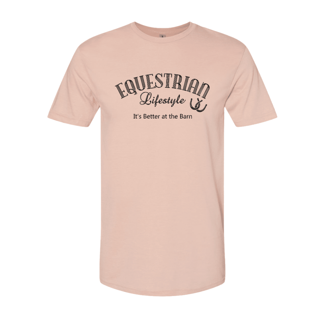 A light peach-pink short-sleeve crewneck t-shirt with a black graphic print on the chest reading 'EQUESTRIAN Lifestyle It's Better at the Barn' with a horseshoe symbol, shown on a plain white background.