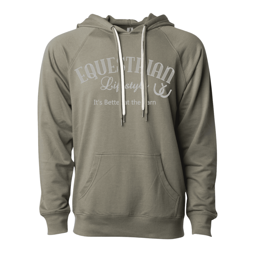 An olive green pullover hoodie with white drawstrings and a white graphic print on the chest that reads 'EQUESTRIAN Lifestyle It's Better at the Barn' with a horsehoe symbol.