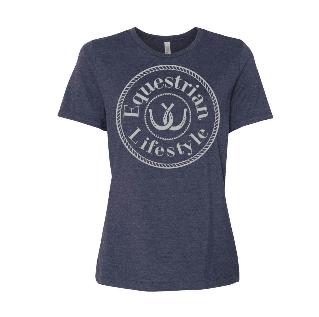 A women's heather navy blue t-shirt with a distressed white circular graphic on the chest that reads 'Equestrian Lifestyle' around a horseshoe illustration.