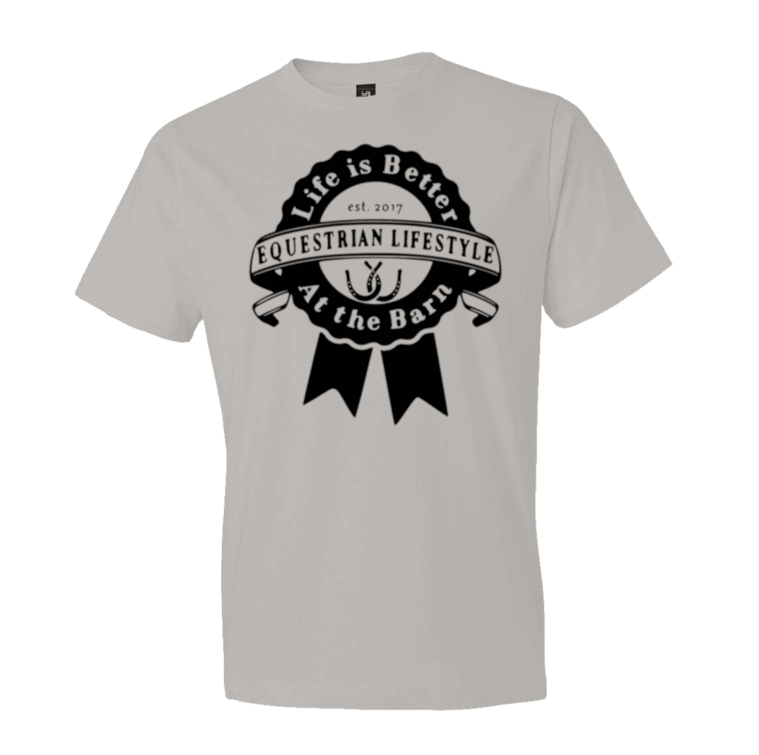 A light gray short-sleeve crewneck t-shirt featuring a black circular graphic on the chest that reads 'Life is Better Equestrian Lifestyle At the Barn' with a horseshoe and ribbon design.