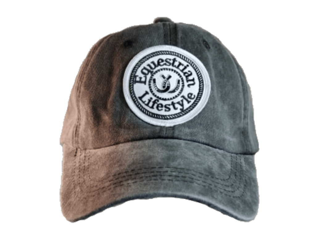 A distressed baseball cap with a brown-to-gray gradient wash, featuring a circular white embroidered patch on the front that reads 'Equestrian Lifestyle'.