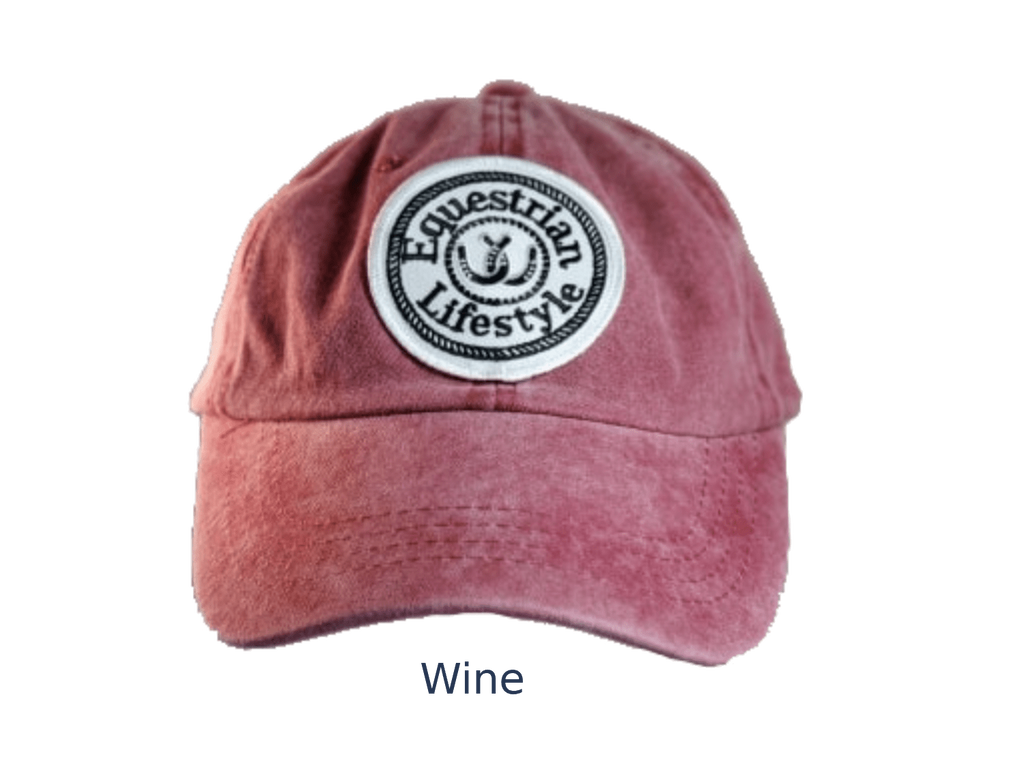 A washed dusty rose or wine-colored baseball cap with a circular white patch on the front that reads 'Equestrian Lifestyle' in black text around a small horse logo. The word 'Wine' appears below the cap on a plain white background.