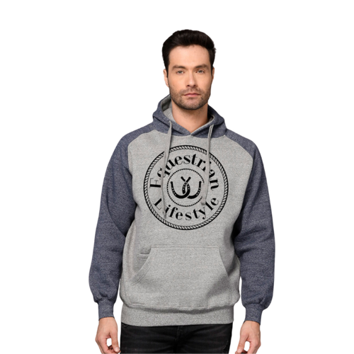 A man wearing a heather gray and navy blue raglan hoodie with a black circular graphic on the chest that reads 'Equestrian Lifestyle' with a horseshoe symbol, 