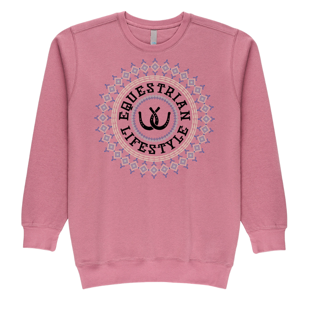 A pink crewneck sweatshirt featuring a circular graphic on the chest with the words 'EQUESTRIAN LIFESTYLE' in black around a central black horse shoe silhouette, surrounded by a pink and blue geometric Aztec pattern.