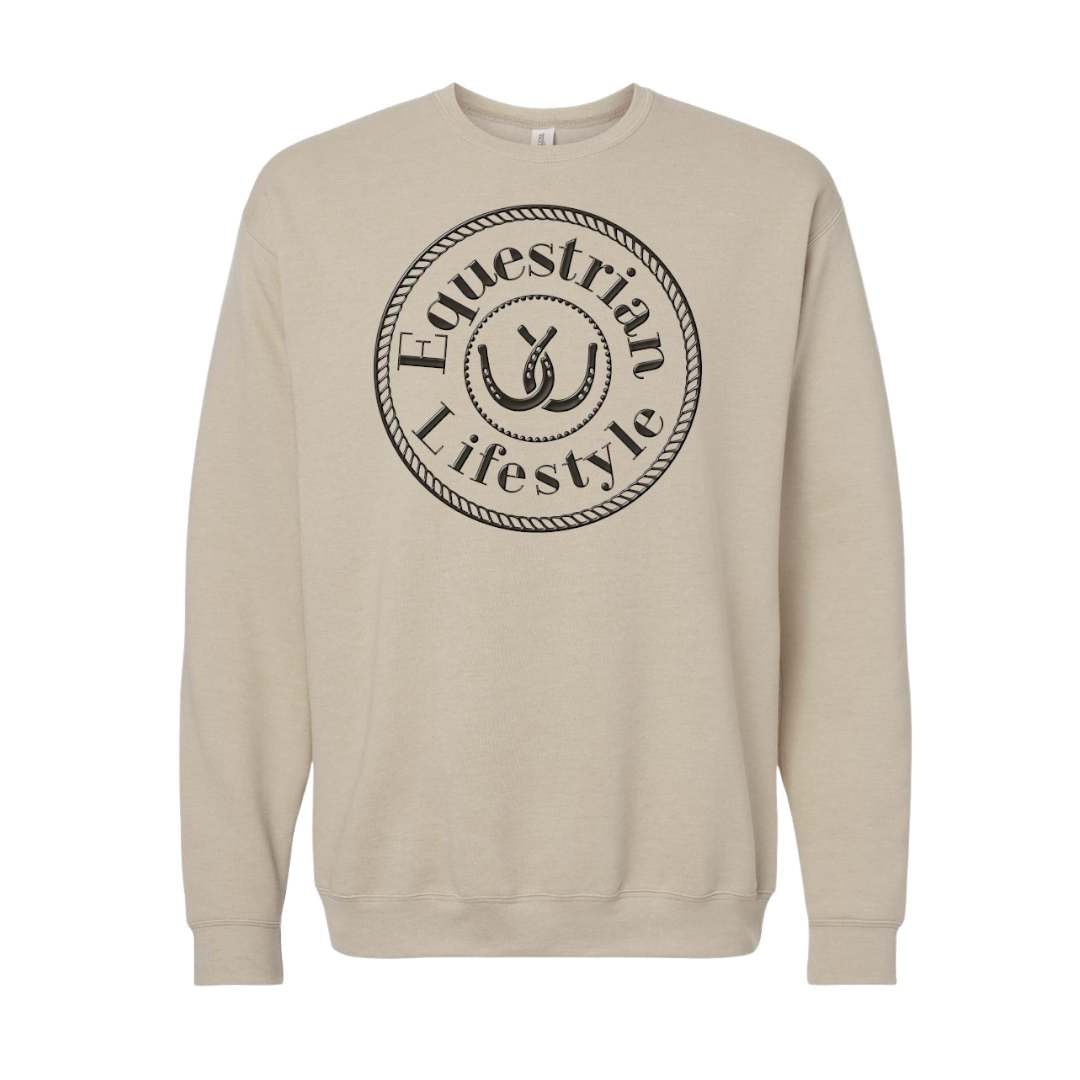 A beige crewneck sweatshirt featuring a black circular graphic on the chest with the words 'Equestrian Lifestyle' and a horseshoe illustration.
