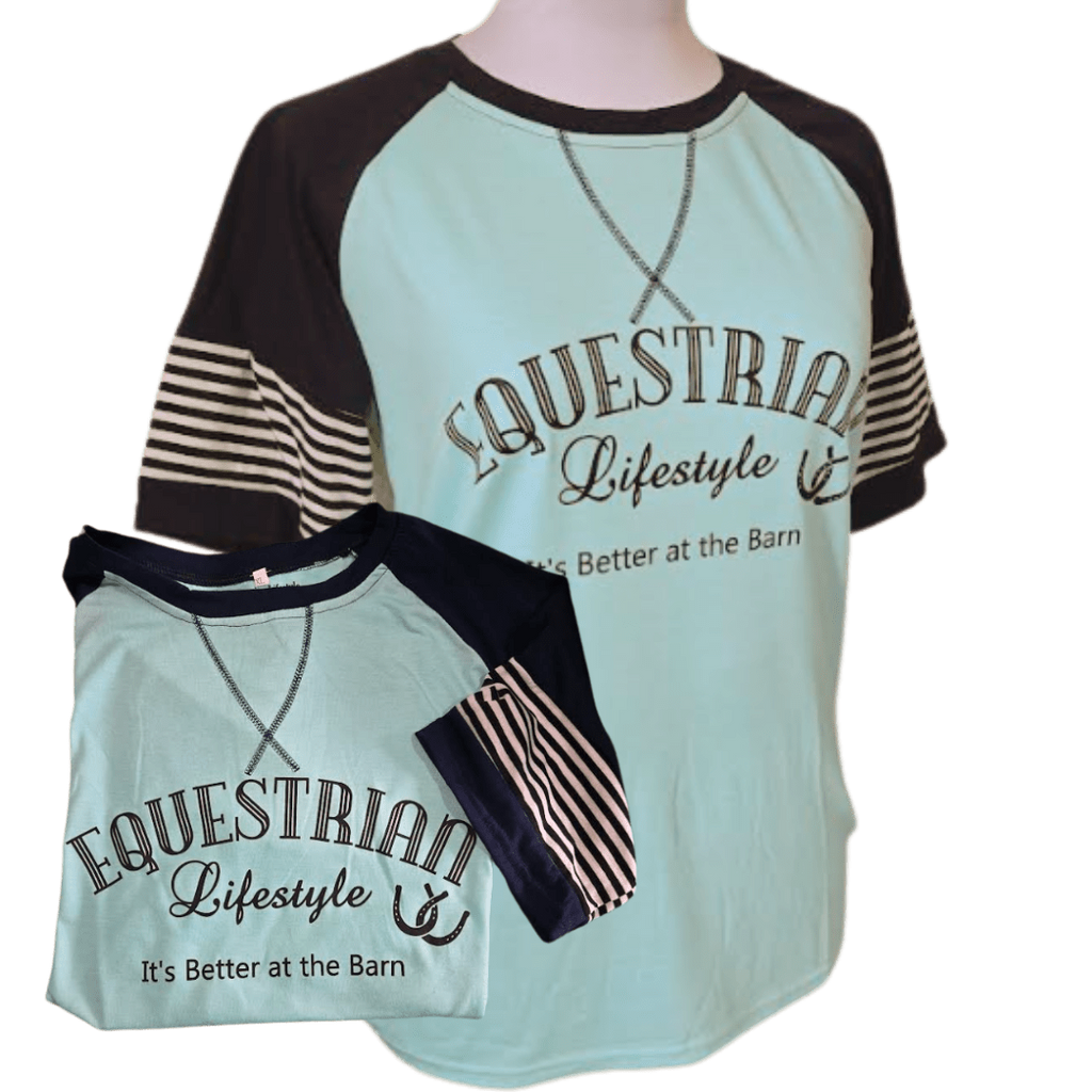 A women's raglan-style t-shirt displayed on a mannequin torso, with a smaller inset showing the folded sleeve detail. The shirt features a light mint green body, dark navy blue collar and sleeve sections, and navy-and-white striped sleeves. Equestrian LIfestyle Its better at the Barn